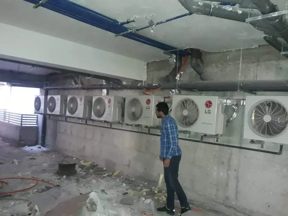 Bank of LG outdoor units installed in a building